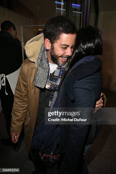 Manu Payet and Leila Bekhti attend the Maison Martin Margiela With H&M Collection Launch at H&M Champs Elysees on November 14, 2012 in Paris, France.