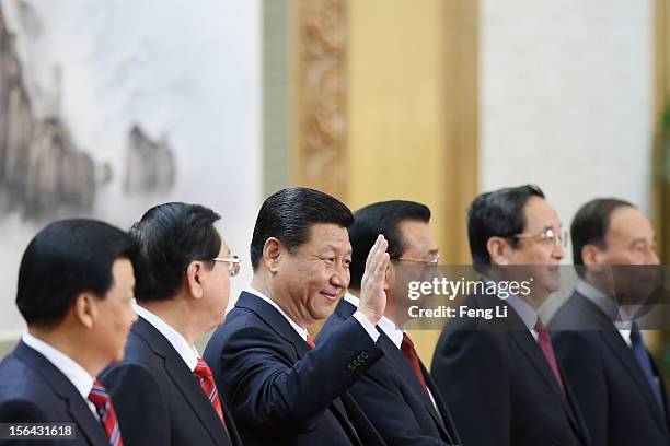 Members of the new Politburo Standing Committee Liu Yunshan, Zhang Dejiang, Xi Jinping, Li Keqiang, Yu Zhengsheng and Wang Qishan greet the media at...