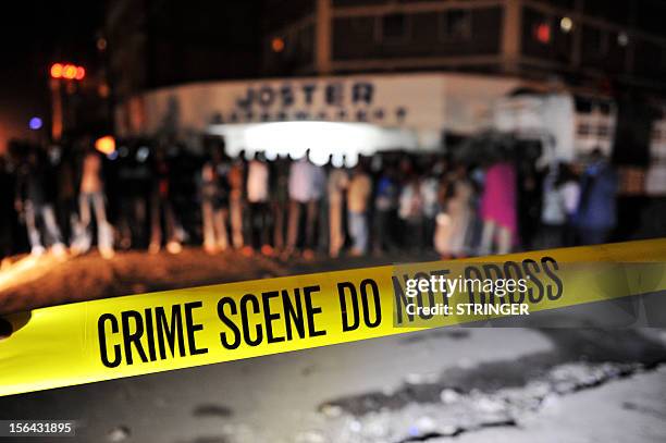Kenyan police investigate the crime scene after an explosive device was detonated in the predominantly Somali populated area of Nairobi, Eastleigh on...