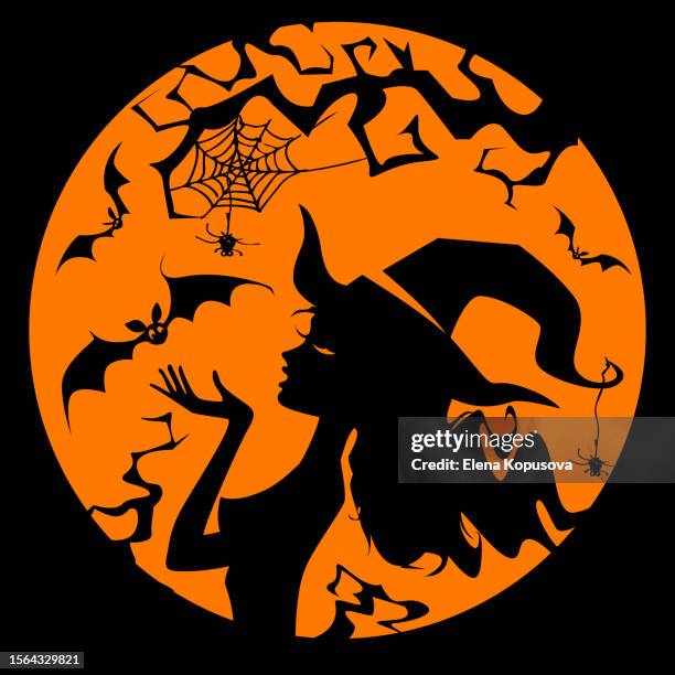 halloween concept in flat style. a young beautiful witch in profile eats a candy with bats on the background of the full moon. - eating candy stock illustrations