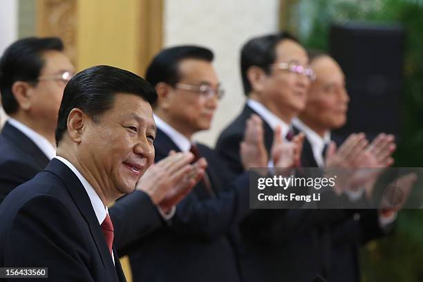 Chinese Vice President Xi Jinping , one of the members of new seven-seat Politburo Standing Committee, delivers a speech as Zhang Dejiang, Li...