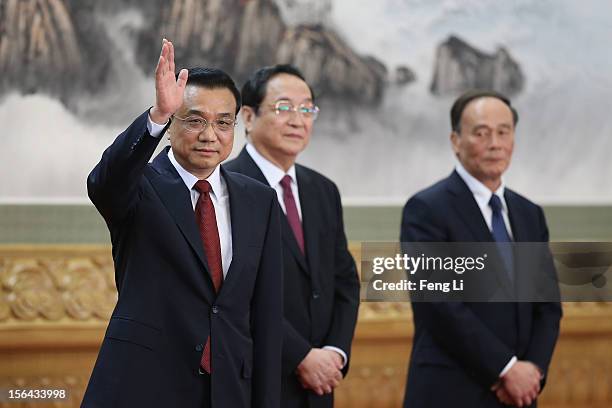 Members of the new Politburo Standing Committee Li Keqiang, Yu Zhengsheng and Wang Qishan greet the media at the Great Hall of the People on November...