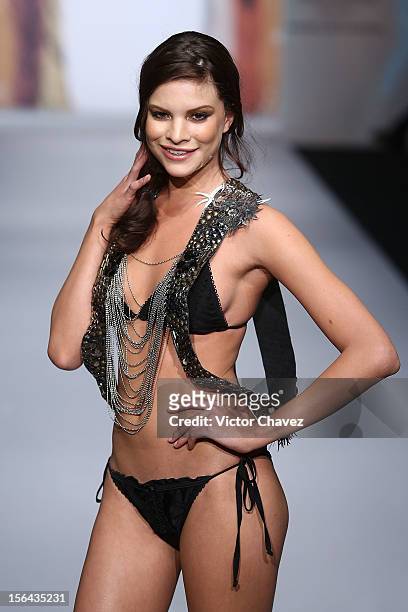 Model walks the runway at the spring/summer 2013 collection of Agua Bendita during the third day of Mereceds-Benz Fashion Week Mexico at Carpa Santa...