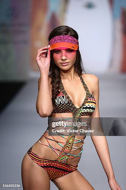 Model walks the runway at the spring/summer 2013 collection of Agua Bendita during the third day of Mereceds-Benz Fashion Week Mexico at Carpa Santa...
