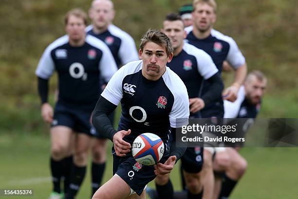 Flyhalf Toby Flood passes the ball during the England training session at Pennyhill Park on November 15, 2012 in Bagshot, England.