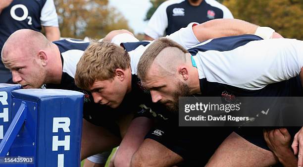 The England front row Joe Marler, Tom Youngs and Dan Cole practice scrummaging during the England training session held at Pennyhill Park on November...