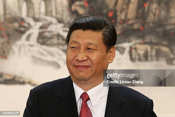 Chinese Vice President Xi Jinping, one of the members of new seven-seat Politburo Standing Committee, delivers a speech after being appointed the new...