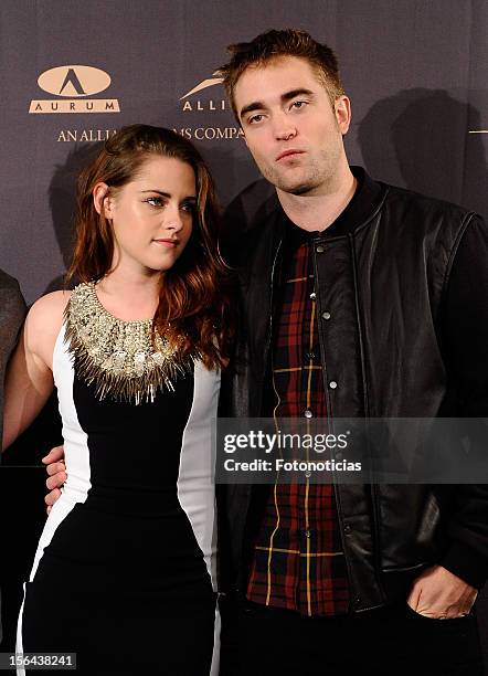 Kristen Stewart and Robert Pattinson attend a photocall for 'The Twilight Saga: Breaking Dawn Part 2' at the Villamagna Hotel on November 15, 2012 in...