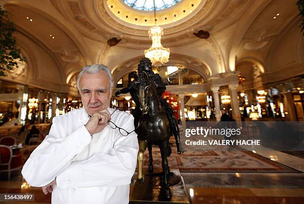French chef Alain Ducasse poses in the famous "Hotel de Paris" in Monaco ahead of celebrations marking the 25th anniversary of his restaurant the...
