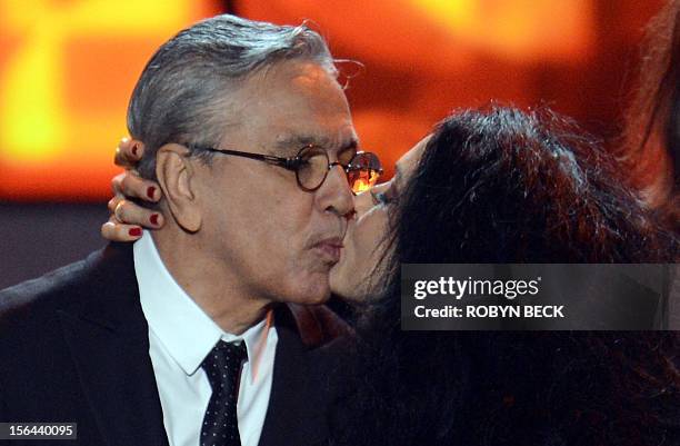 Brazilian musician Caetano Veloso kisses actress Sonia Braga after accepting his award at the 2012 Latin Recording Academy Person of the Year gala in...