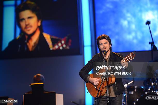 Colombian singer Juanes performs at the 2012 Latin Recording Academy Person of the Year gala, honoring musician Caetano Veloso of Brazil, on November...