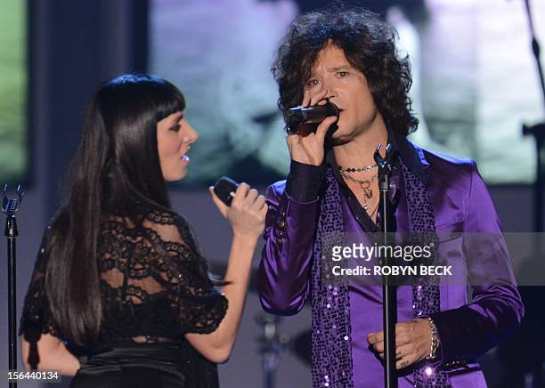 Spanish singers La Mala and Enrique Bunbury perform at the 2012 Latin Recording Academy Person of the Year gala, honoring musician Caetano Veloso of...