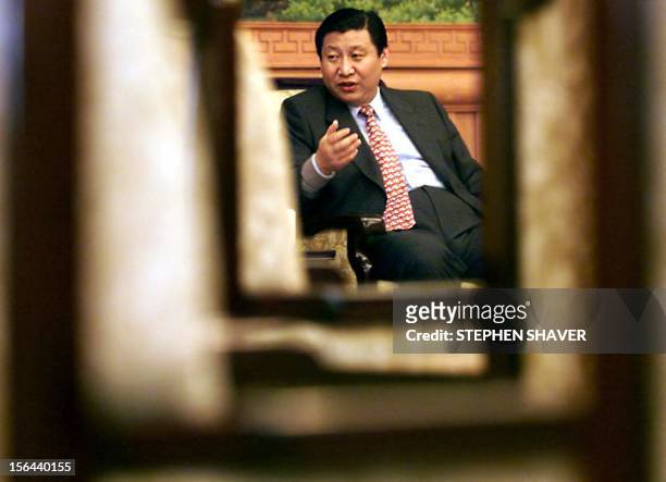 Governor of China's coastal Fujian province, Xi Jinping, responds to a journalist's question 23 February 2000 during an interview at the central...