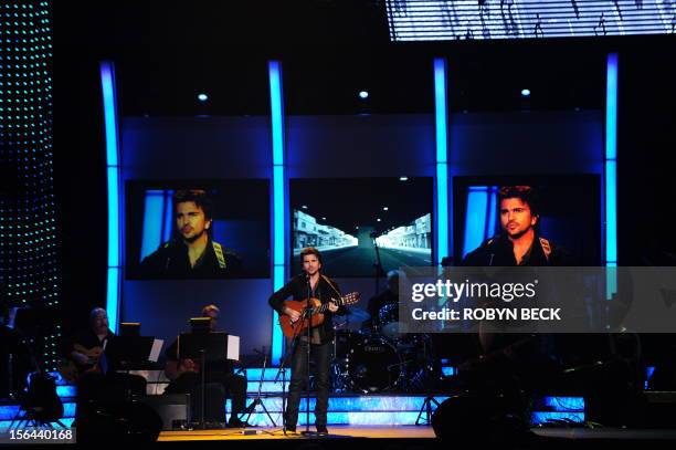 Colombian singer Juanes performs at the 2012 Latin Recording Academy Person of the Year gala, honoring musician Caetano Veloso of Brazil, on November...