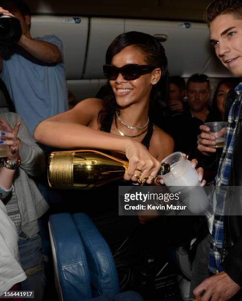 Rihanna celebrates with fans on the plane to her first stop on the 777 tour on November 14, 2012. Rihanna's 777 Tour - 7 countries, 7 days, 7 shows...
