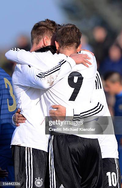 Yannick Gerhardt, Patrick Weihrauch and Fabian Schnellhardt of Germany celebrate the opening goal during the International Friendly match between U19...