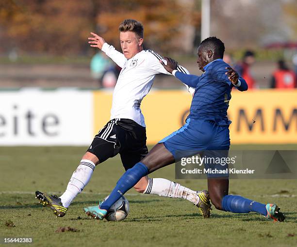 Yannick Gerhardt of Germany challenges Benjamin Mendy during the International Friendly match between U19 Germany and U19 France at Rheinstadium on...