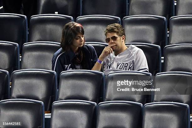 Two fans of the New York Yankees look on dejected after the Yankees lost 3-0 against the Detroit Tigers during Game Two of the American League...