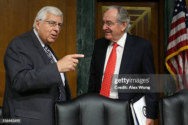 Committee chairman Sen. Tom Harkin talks to ranking member Sen. Michael Enzi prior to a hearing before the Senate Health, Education, Labor and...