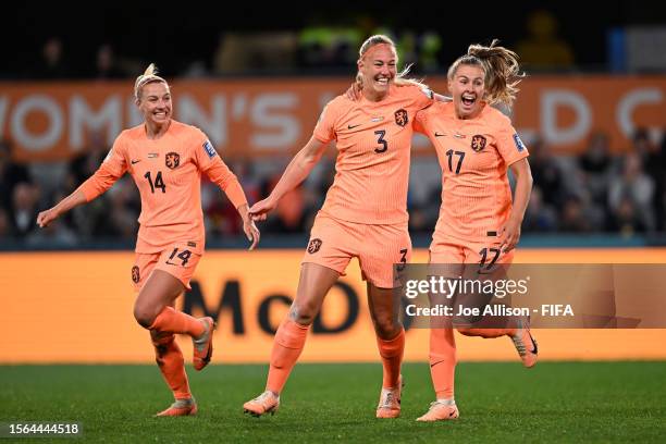 Stefanie Van Der Gragt of Netherlands celebrates with teammates Jackie Groenen and Victoria Pelova after scoring her team's first goal before once...