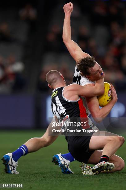 Callum Wilkie of the Saints tackles Nick Larkey of the Kangaroos high during the round 19 AFL match between St Kilda Saints and North Melbourne...