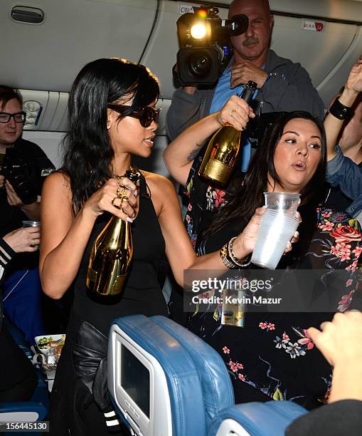 Rihanna greets guests on the plane to her first stop on the 777 tour on November 14, 2012. Rihanna's 777 Tour - 7 countries, 7 days, 7 shows in...