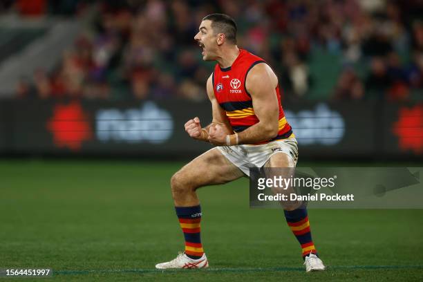 Taylor Walker of the Crows celebrates kicking a goal during the round 19 AFL match between Melbourne Demons and Adelaide Crows at Melbourne Cricket...