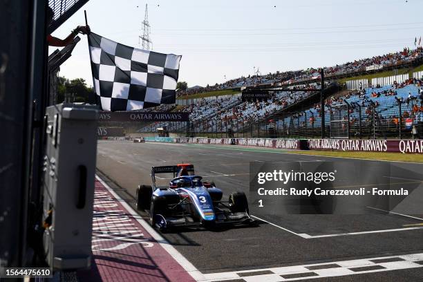 Race winner Zak O'Sullivan of Great Britain and PREMA Racing takes the chequered flag during the Round 8:Budapest Feature race of the Formula 3...