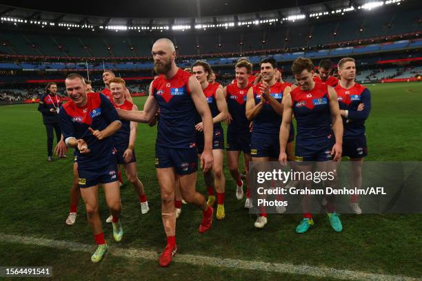 The Demons celebrate victory in the round 19 AFL match between Melbourne Demons and Adelaide Crows at Melbourne Cricket Ground on July 23, 2023 in...