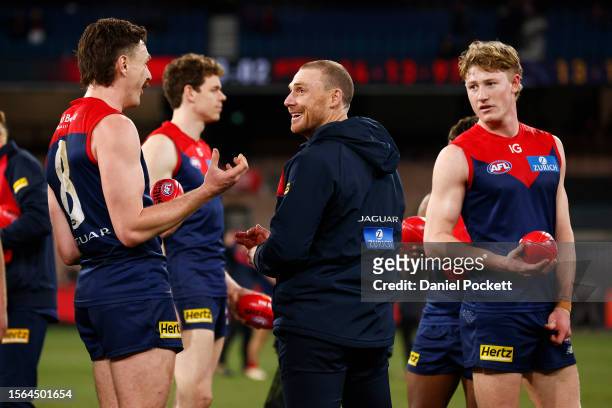 Demons head coach Simon Goodwin celebrates with Jake Lever of the Demons after winning the round 19 AFL match between Melbourne Demons and Adelaide...