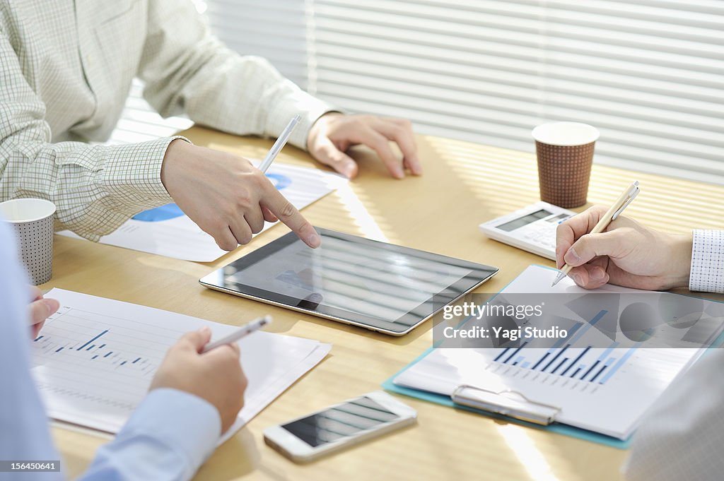 Businessmen  having discussion in office