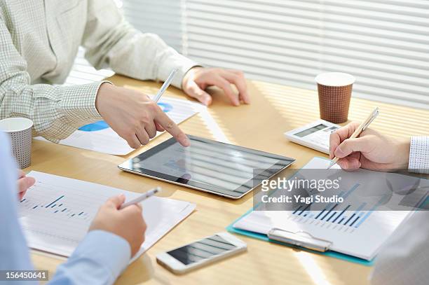 businessmen  having discussion in office - business man smartphone tablet stock pictures, royalty-free photos & images
