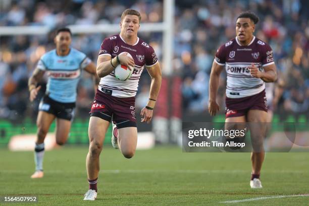 Reuben Garrick of the Manly Sea Eagles runs the ball during the round 21 NRL match between Cronulla Sharks and Manly Sea Eagles at PointsBet Stadium...