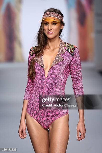 Model walks the runway at the spring/summer 2013 collection of Agua Bendita during the third day of Mereceds-Benz Fashion Week Mexico at Carpa Santa...