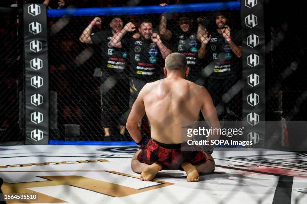 Sofiane Oudina kneels to celebrate his victory during the Hexagone MMA 10 event. In France, the "Hexagone MMA 10" event took place at the Roman...