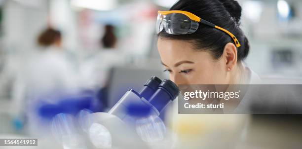research laboratory microscope - chinese scientist stock pictures, royalty-free photos & images