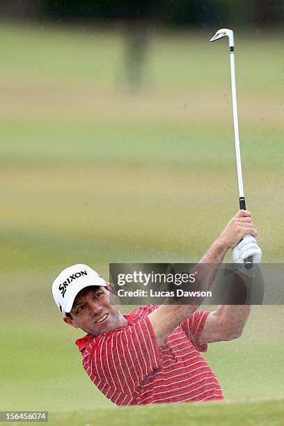 Andrew Tschudin of Australia plays a shot out of the bunker during day two of the Australia Masters at Kingston Heath Golf Club on November 16, 2012...