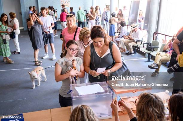Two women vote in the general elections at a polling station on July 23, 2023 in Madrid, Spain. Voters in Spain head to the polls on July 23 to cast...