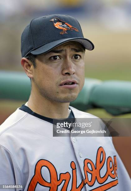 Rodrigo Lopez of the Baltimore Orioles looks on from the dugout before a game against the Pittsburgh Pirates at PNC Park on June 7, 2005 in...
