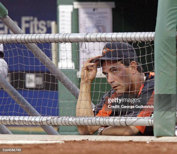 Manager Lee Mazzilli of the Baltimore Orioles looks on from the dugout during a game against the Pittsburgh Pirates at PNC Park on June 7, 2005 in...