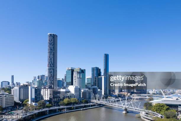 brisbane city skyline from above brisbane river - brisbane cityscape stock pictures, royalty-free photos & images