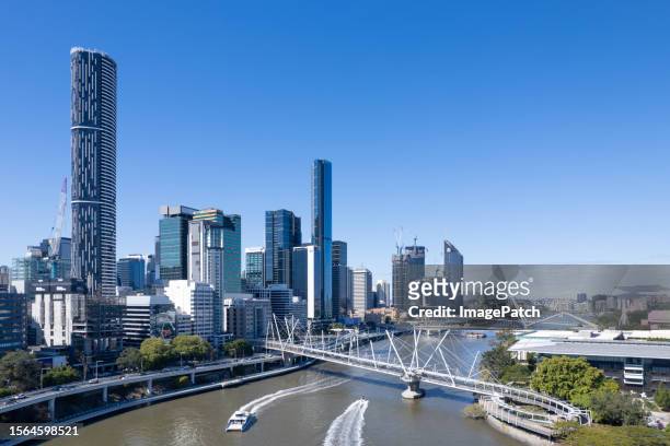 brisbane city skyline from above brisbane river - brisbane river stock pictures, royalty-free photos & images