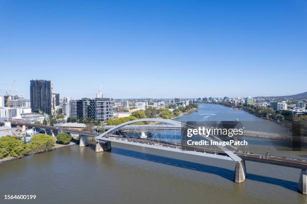 brisbane city skyline from above brisbane river - brisbane river stock pictures, royalty-free photos & images