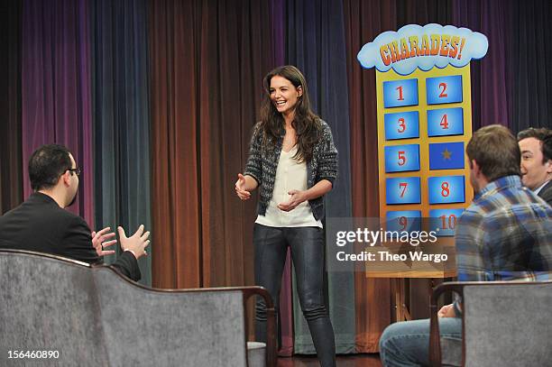 Katie Holmes and Jimmy Fallon play a game of Charades during a taping of "Late Night With Jimmy Fallon" at Rockefeller Center on November 15, 2012 in...