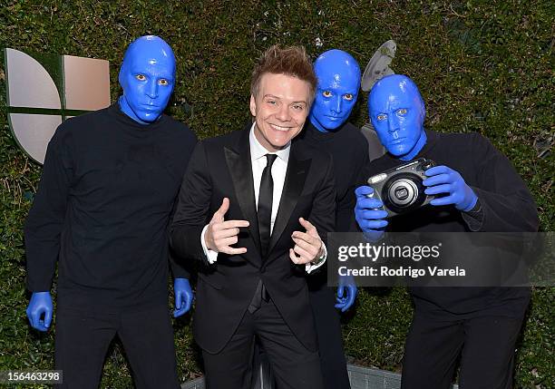 Singer/songwriter Michel Telo with Blue Man Group arrive at the 13th annual Latin GRAMMY Awards held at the Mandalay Bay Events Center on November...