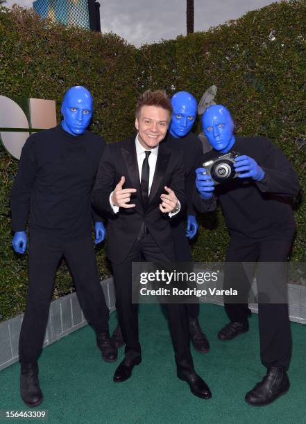 Singer/songwriter Michel Telo with Blue Man Group arrive at the 13th annual Latin GRAMMY Awards held at the Mandalay Bay Events Center on November...