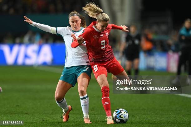 Switzerland's forward Ana-Maria Crnogorevic and New Zealand's defender Ali Riley fight for the ball during the Australia and New Zealand 2023 Women's...