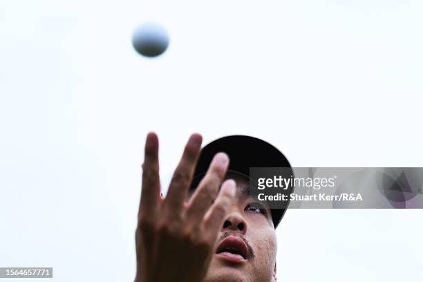 Min Woo Lee of Australia throws their ball into the crowd on the 18th hole during Day Three of The 151st Open at Royal Liverpool Golf Club on July...