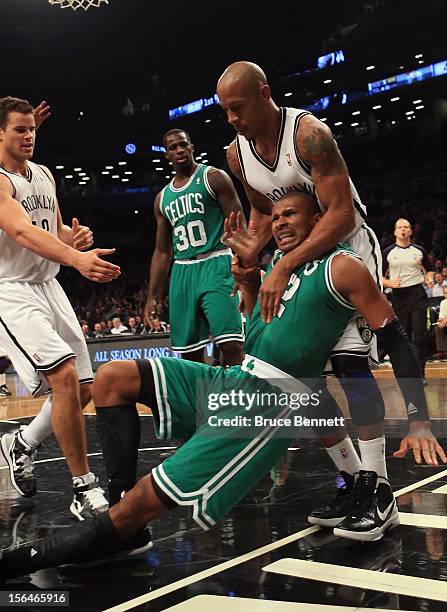 Keith Bogans of the Brooklyn Nets fouls Leandro Barbosa of the Boston Celtics in the second quarter at the Barclays Center on November 15, 2012 in...