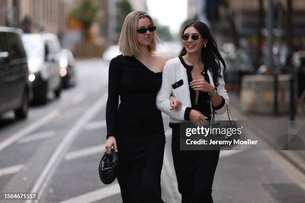 Isabelle Hartmann is seen wearing golden earrings from Yves Saint Laurent, black narrow sunglasses from Saint Laurent, a black one shoulder...